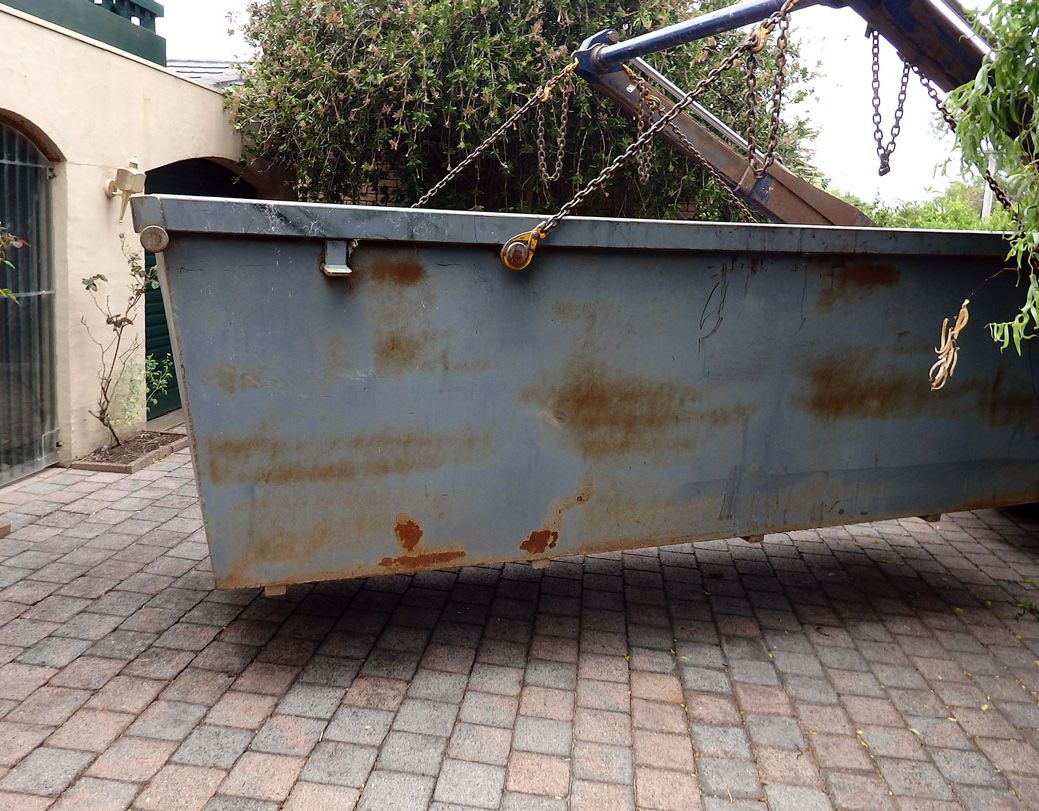 A skip being delivered to a customer